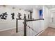 View of a staircase with Disney character artwork and Mickey Mouse lighting fixtures on the walls at 2352 Zaballina Pl, Kissimmee, FL 34747