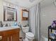Functional bathroom featuring tiled shower and vanity with storage at 2507 E Central Blvd # 21, Orlando, FL 32803