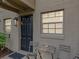 Inviting front entrance with a dark door and an outdoor seating area at 2507 E Central Blvd # 21, Orlando, FL 32803