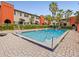 Beautiful community pool surrounded by lush landscaping at 2507 E Central Blvd # 21, Orlando, FL 32803