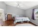 Serene bedroom showcasing a vaulted ceiling and an ensuite bathroom, perfect for relaxation at 2622 Jennifer Dr, Lakeland, FL 33810