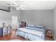 Relaxing bedroom with a vaulted ceiling, soothing colors, and an ensuite bathroom entrance at 2622 Jennifer Dr, Lakeland, FL 33810