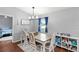 Comfortable dining room with a modern chandelier and adjacent to a bedroom, great for Gathering meals at 2622 Jennifer Dr, Lakeland, FL 33810