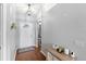 Bright entryway with wood-look flooring and a stylish pendant light fixture at 2622 Jennifer Dr, Lakeland, FL 33810