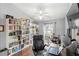 Inviting office with lots of natural light and a large bookshelf, desk, and equipment at 2622 Jennifer Dr, Lakeland, FL 33810