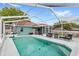 Relax by the screened-in pool, which features a clean deck and inviting seating area at 2622 Jennifer Dr, Lakeland, FL 33810
