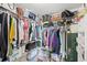 Spacious walk-in closet features ample storage with metal shelving and rods at 2622 Jennifer Dr, Lakeland, FL 33810
