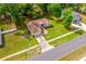 Aerial view of the home displaying its location within a wooded neighborhood at 304 Woods Landing Dr, Lady Lake, FL 32159
