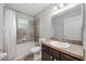 Bathroom featuring a shower-tub combination and single sink vanity at 304 Woods Landing Dr, Lady Lake, FL 32159