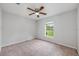 Cozy bedroom with a neutral color palette and carpeted floor, providing a calm retreat at 304 Woods Landing Dr, Lady Lake, FL 32159