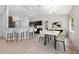 Dining area featuring modern lighting, bar seating, and a stylish table with chairs at 304 Woods Landing Dr, Lady Lake, FL 32159