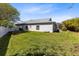 Wide view of the backyard with plenty of green grass and space at 3469 Foxton Ct, Oviedo, FL 32765