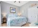 Cozy bedroom with marine decor, plush bed, and ample natural light at 3469 Foxton Ct, Oviedo, FL 32765