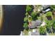 Bird's-eye view of a waterfront home featuring private dock access and lush green surroundings at 3655 E Osceola Rd, Geneva, FL 32732