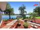 Landscaped backyard with brick pavers, leading to dock, river view at 3655 E Osceola Rd, Geneva, FL 32732