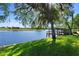 Scenic view of the lush backyard and waterfront dock at 3655 E Osceola Rd, Geneva, FL 32732
