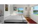 Bright bedroom featuring a murphy bed, waterfront views and light colored walls at 3655 E Osceola Rd, Geneva, FL 32732