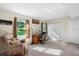 Bedroom featuring neutral walls, a comfortable chair and a closet with folding doors at 3655 E Osceola Rd, Geneva, FL 32732