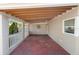 Spacious carport area with white columns and exposed beam ceilings at 3655 E Osceola Rd, Geneva, FL 32732