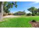 The house features a well-maintained lawn and inviting curb appeal with mature trees around the property at 3655 E Osceola Rd, Geneva, FL 32732