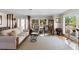Bright living room featuring a neutral color palette, large windows, and comfortable seating at 3655 E Osceola Rd, Geneva, FL 32732