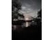 Scenic waterfront view at night with a bright full moon reflecting on the tranquil water at 3655 E Osceola Rd, Geneva, FL 32732