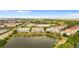 Wide aerial shot of the condo community with expansive lake views, lush landscaping, and surrounding urban areas at 4114 Breakview Dr # 11002, Orlando, FL 32819