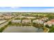 Beautiful aerial view of the condos, lake, landscaping and exterior walking path around the community at 4114 Breakview Dr # 11002, Orlando, FL 32819