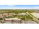 Overhead view features the buildings, community pool, nearby shopping, waterways, and extensive landscaping at 4114 Breakview Dr # 11002, Orlando, FL 32819