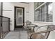 Cozy outdoor balcony with seating and door with window at 4114 Breakview Dr # 11002, Orlando, FL 32819