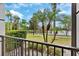 Outdoor balcony with lush green view overlooking lake and landscaping at 4114 Breakview Dr # 11002, Orlando, FL 32819