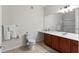 Bathroom with a vanity, toilet, and a glass-enclosed shower at 4114 Breakview Dr # 11002, Orlando, FL 32819
