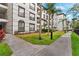 Exterior view of the building surrounded by lush landscaping and sidewalks at 4114 Breakview Dr # 11002, Orlando, FL 32819