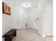 Bright condo foyer with tiled floors, white walls, and a bench, offering a clean and welcoming entry area at 4114 Breakview Dr # 11002, Orlando, FL 32819