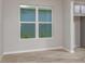 Bright living room with wood floors, a view to the outside, and neutral paint at 4147 Coral Harbour Rd, Kissimmee, FL 34758