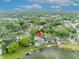 Aerial view features a home with a private pool, deck, and direct access to the tranquil lake at 417 Barclay Ave, Altamonte Springs, FL 32701