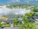 An aerial view showcases this lakeside residence with a beautiful lake backdrop at 417 Barclay Ave, Altamonte Springs, FL 32701