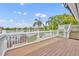 Stunning lake view from the wooden back porch, featuring a white railing and stairway at 417 Barclay Ave, Altamonte Springs, FL 32701