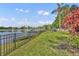 Fenced backyard features mature landscaping, a private boat dock, and direct access to the lake at 417 Barclay Ave, Altamonte Springs, FL 32701