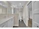 Bathroom with double vanity, white cabinets, and a walk-in shower with glass divider at 417 Barclay Ave, Altamonte Springs, FL 32701