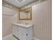 Bathroom with a vanity, sink, mirror, and patterned wall coverings at 417 Barclay Ave, Altamonte Springs, FL 32701