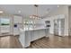 Spacious, updated kitchen with a large island, modern lighting, white cabinets, and stainless appliances at 417 Barclay Ave, Altamonte Springs, FL 32701