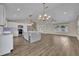 Bright and airy kitchen with stainless steel appliances and a large gray center island at 417 Barclay Ave, Altamonte Springs, FL 32701