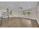 Bright, open-concept living room with wood floors, recessed lighting, and staircase at 417 Barclay Ave, Altamonte Springs, FL 32701
