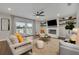 Cozy living room with a fireplace and sliding glass door to a lake view back porch at 417 Barclay Ave, Altamonte Springs, FL 32701