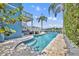 Beautiful backyard featuring a pool, deck, and view of the lake with palm trees at 417 Barclay Ave, Altamonte Springs, FL 32701