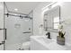 Stylish bathroom with a glass shower, modern vanity, and elegant decor at 4729 Arrow Rd, Orlando, FL 32812