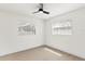 Empty room with light wood flooring and a ceiling fan at 4729 Arrow Rd, Orlando, FL 32812