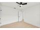 Bright bedroom features neutral walls, light flooring, and a modern ceiling fan, creating a serene atmosphere at 4729 Arrow Rd, Orlando, FL 32812