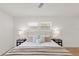 Comfortable bedroom featuring neutral tones, stylish lamps, and a ceiling fan at 4729 Arrow Rd, Orlando, FL 32812